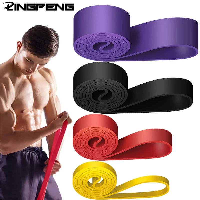 Athlete performing a band pull-apart exercise using high-density resistance band, showing tension and form for shoulder and upper back training.