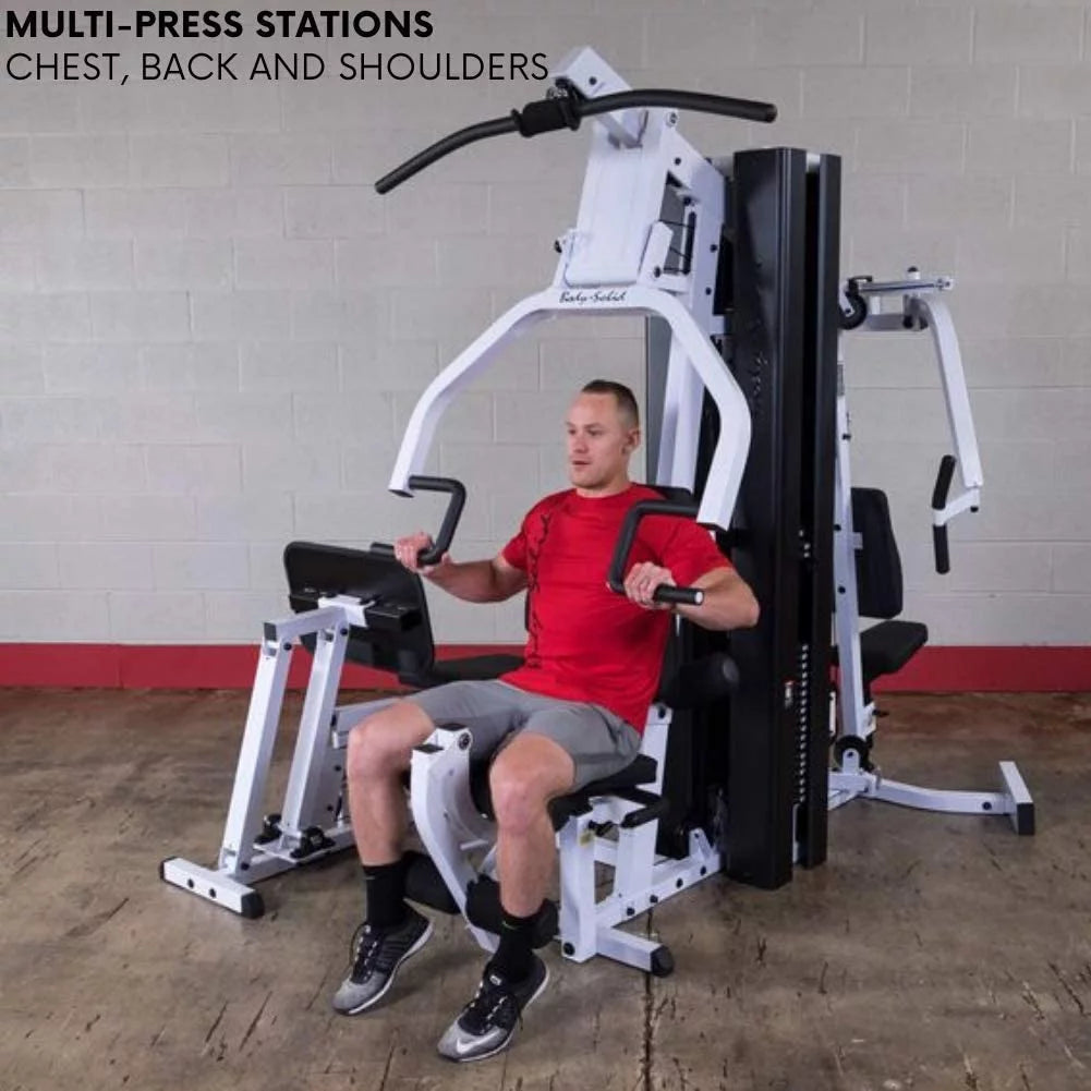High and low cable pulley stations on EXM3000LPS, including lat bar, low row attachments, and mid pulley configuration for versatile back, tricep, and ab exercises.