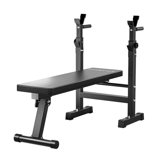 Folding adjustable weight bench with barbell rack in full view, showing bench frame, rack uprights, bench pad, and overall build for home gym use.