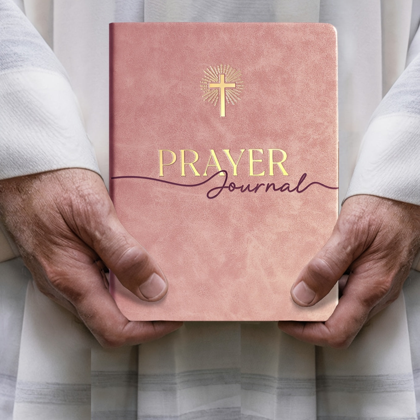 Journal held in hand to show size and portability — how the 180-day prayer journal fits into daily carry or personal space for spiritual journaling.