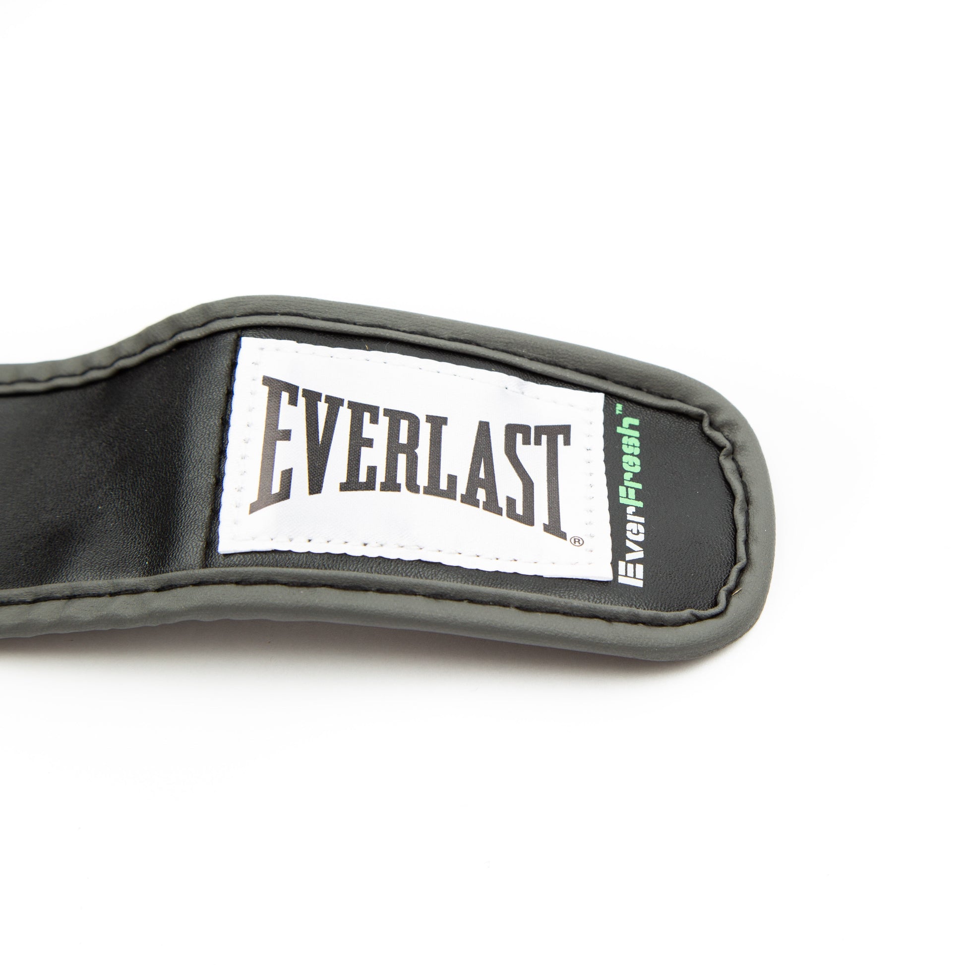 Pair of black wristwrap heavy bag gloves laid flat on white background showing both top and palm sides, including wrap strap layout and glove shape.