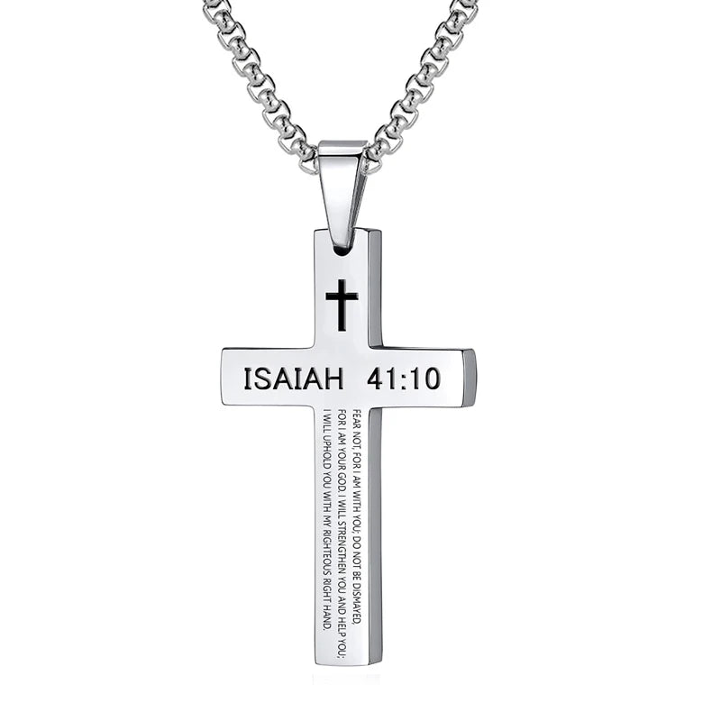 The cross pendant necklace packaged in a gift box along with the chain and protective inserts, showing how the product is presented to the buyer.