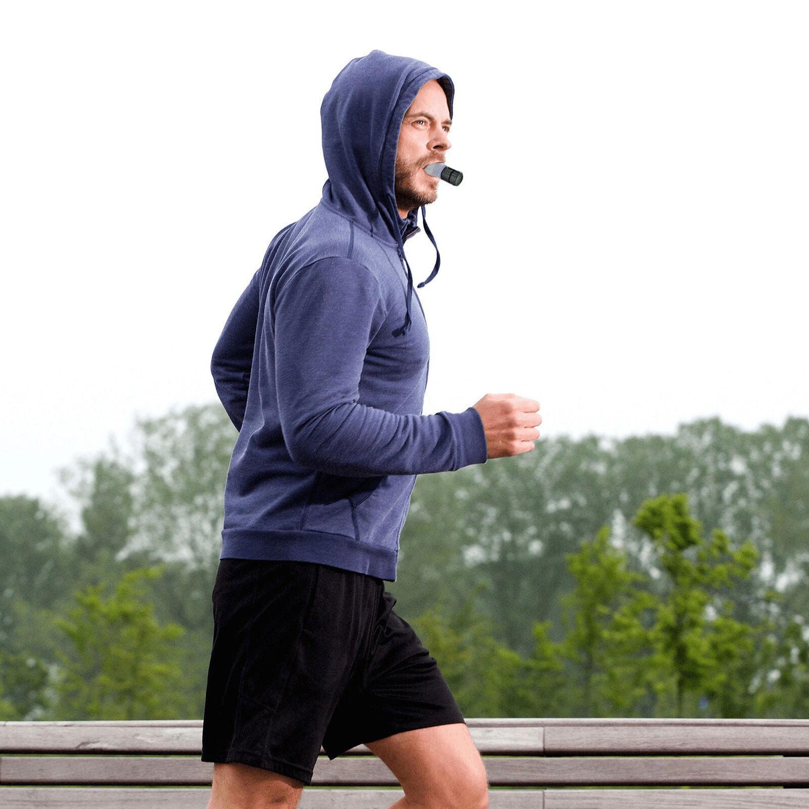 Breathing trainer with motion blur effect to illustrate active airflow through the device, representing how inhalation / exhalation resistance works when in use.