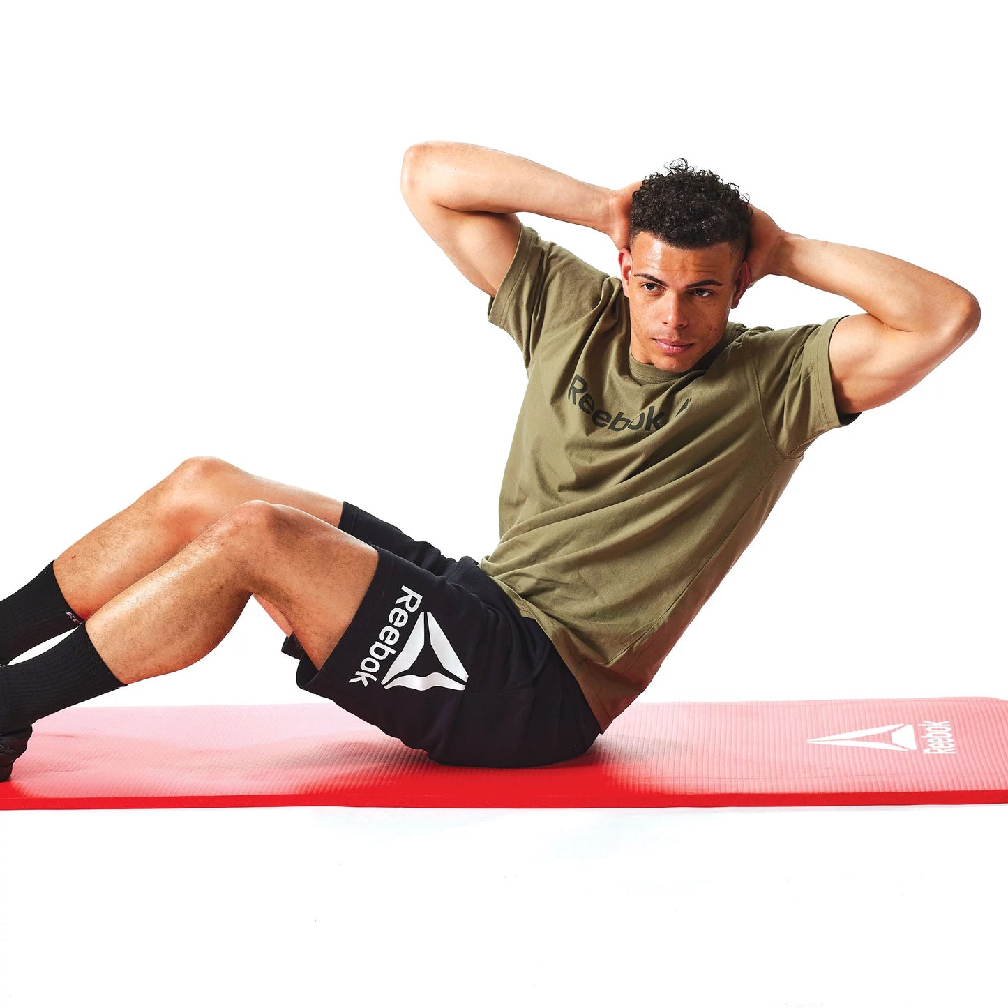 Person doing floor workout on red 15 mm Pro Fitness Mat