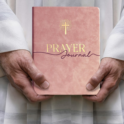 Journal held in hand to show size and portability — how the 180-day prayer journal fits into daily carry or personal space for spiritual journaling.