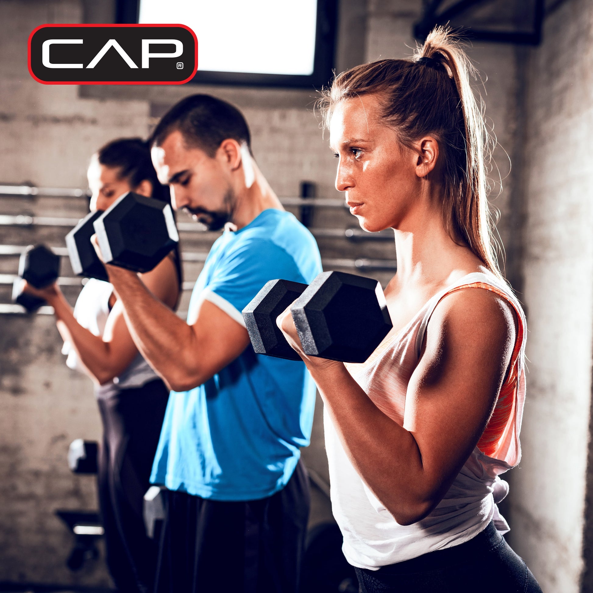 Pair of 20 lb rubber hex dumbbells standing on their hex heads to display anti-roll design, proving stability and safety during storage or rest between sets.