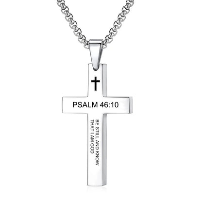 Cross pendant placed near an open Bible or scripture page, setting a faith-inspired context and reinforcing the spiritual theme of the product.