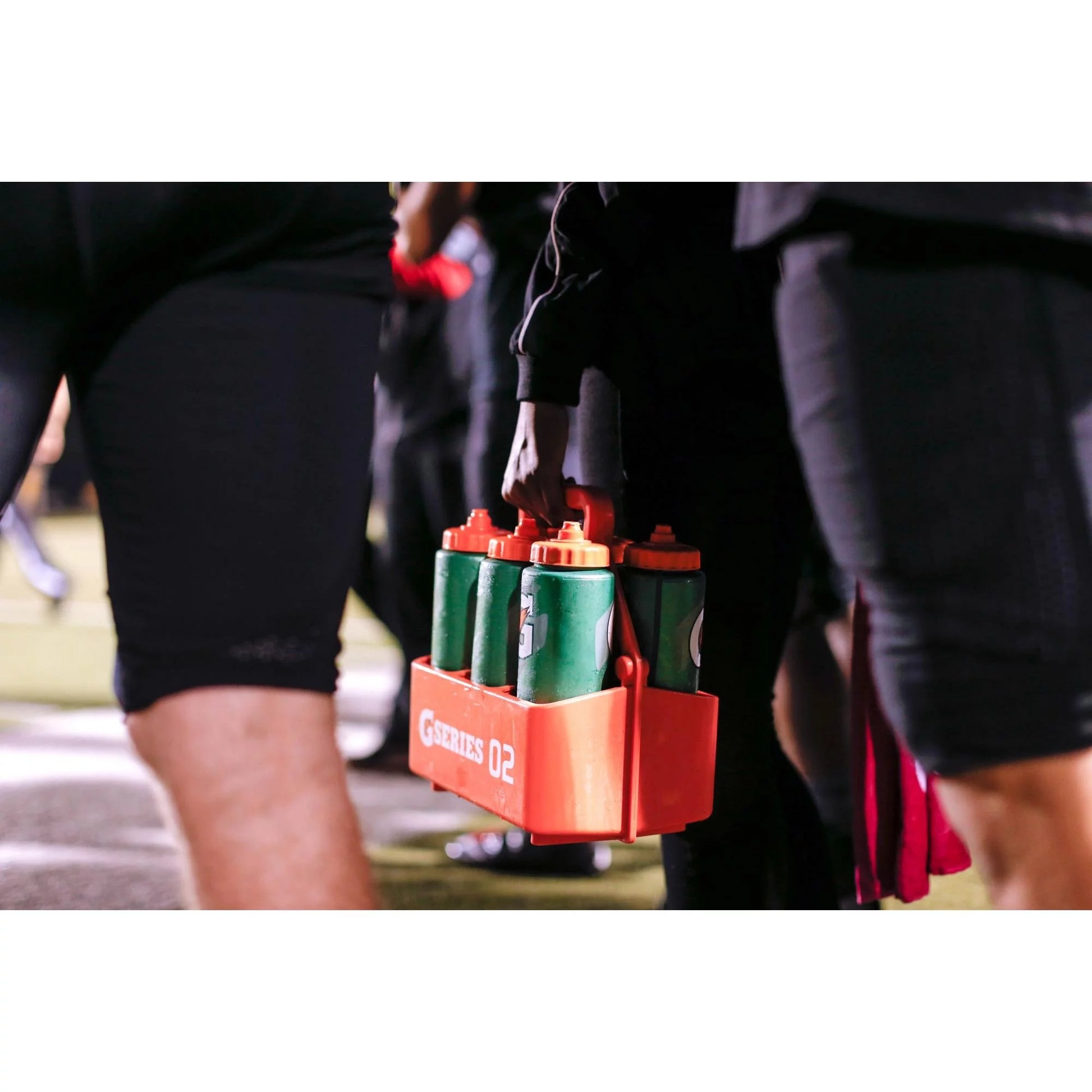 User holding the contour squeeze water bottle during workout, demonstrating grip comfort and ease of sipping without interrupting exercise flow.