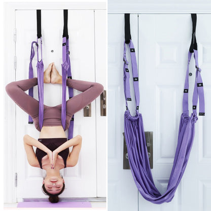 User using the hip stretch belt on a door anchor, demonstrating split stretch training with inverted rope pull, showing how the belt supports flexibility and control safely.